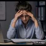 Stressed at the desk during overtime